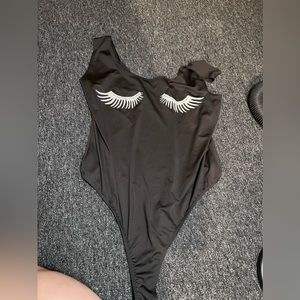 Black body suit with lashes